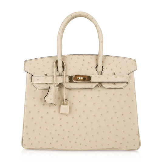 Soft Parchment Cream Tiny Raised Dot Compact Boxy Structured Hand Tote With Neat Matching Light Edge Stitching, Polished Golden Twist Lock Hardware And Coordinating Dotted Suspended Tag Small Solid Metal Padlock Charm